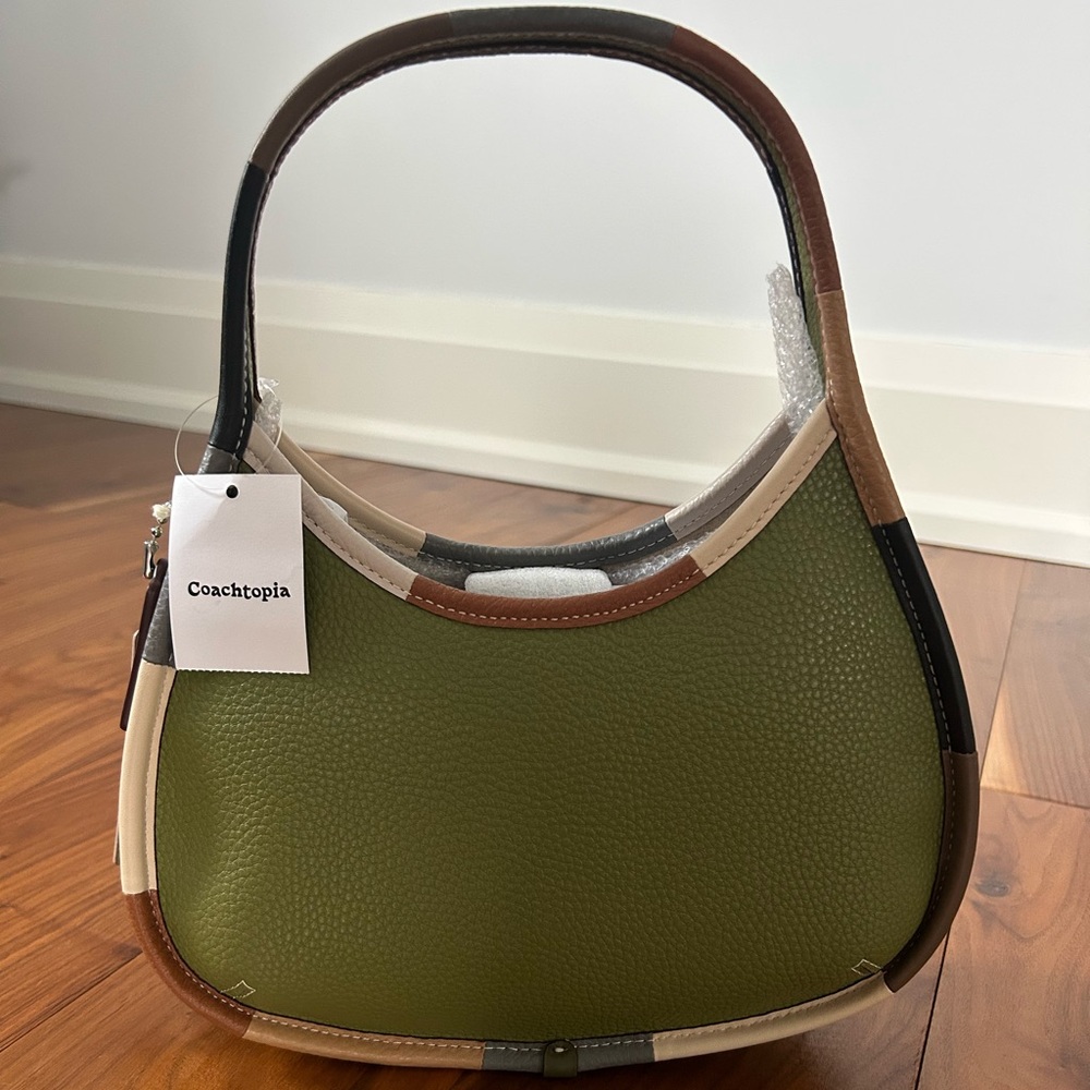 Coachtopia Ergo Bag In Coachtopia Leather With Colorful Binding in Olive Green.